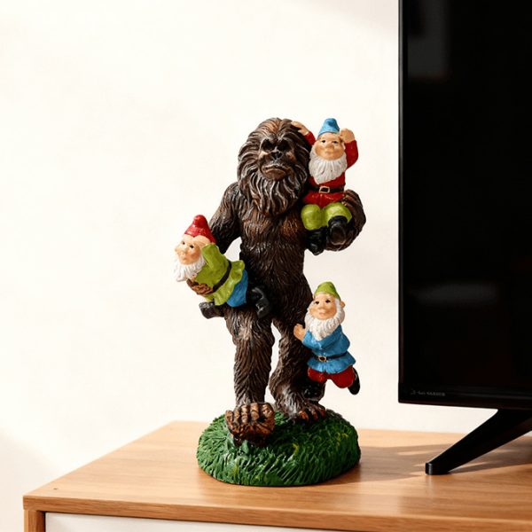 Bigfoot statue carrying garden gnomes