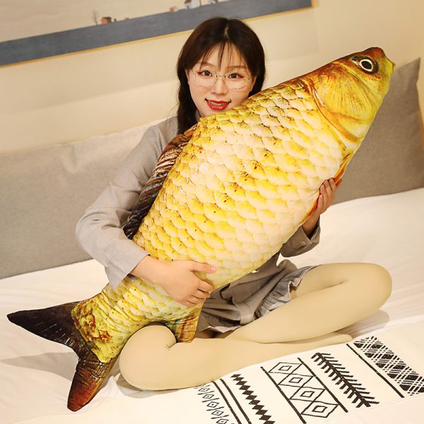 Holding the giant golden carp pillow