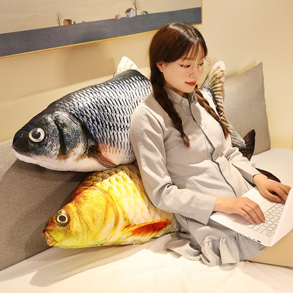 Giant grey carp pillow on the sofa