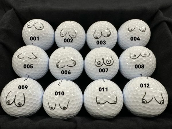 Twelve golf balls with different doodles