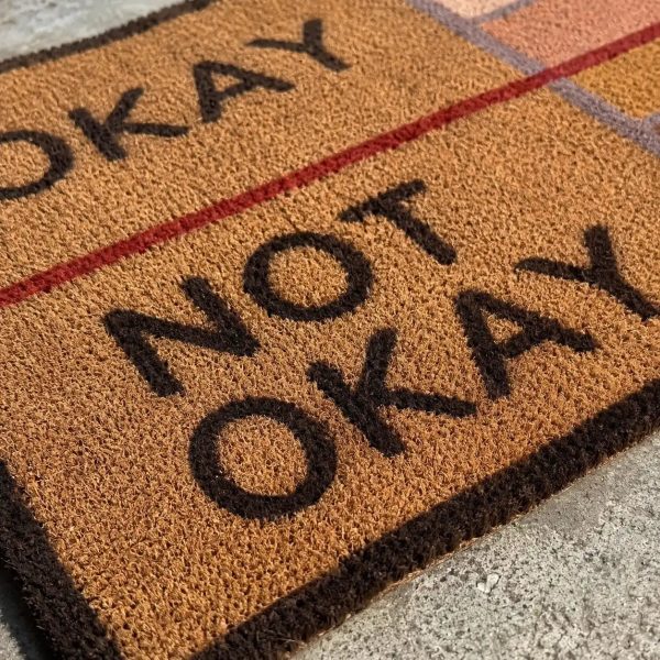 Close up of the OKAY NOT OKAY scale