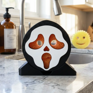 The screaming ghost sponge holder with an orange sponge face