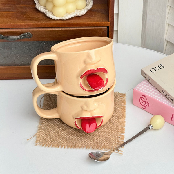 Two tongue mugs stacked