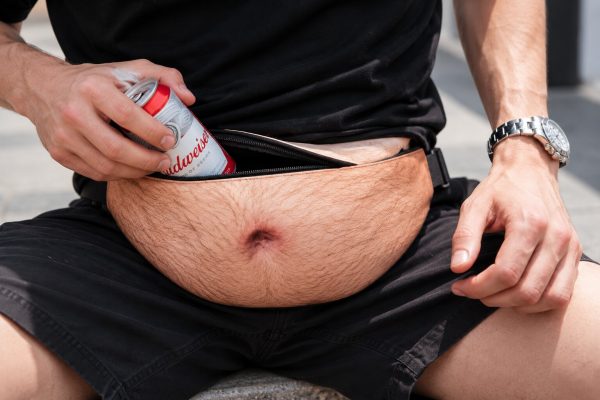 Beer belly bag unzipped with a beer can inside