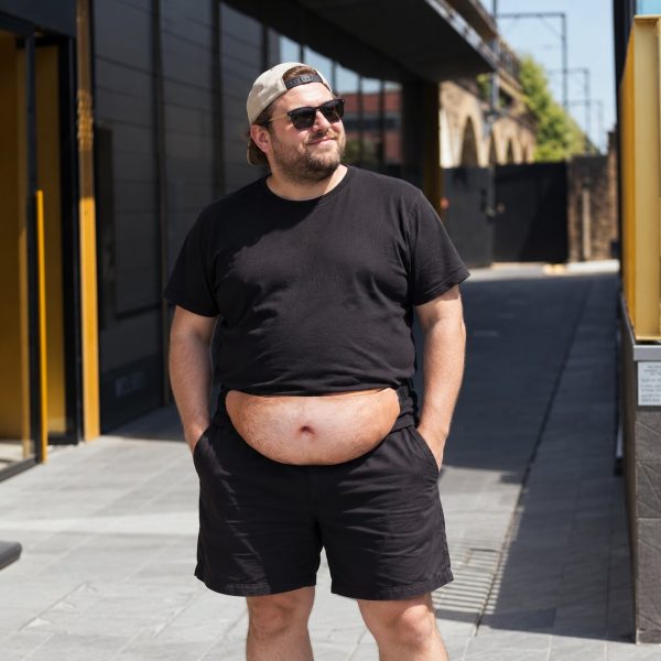 Man wearing the beer belly bag on a city street