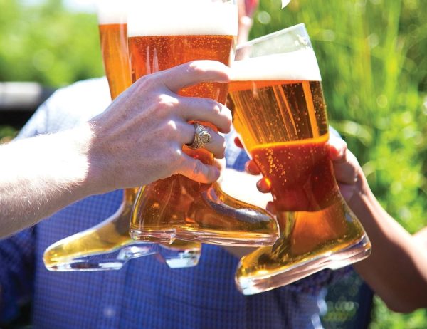 Toasting with 1 litre beer boot glasses