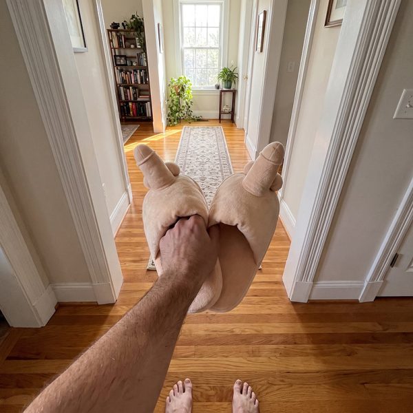 Plush slippers shaped like giant fists