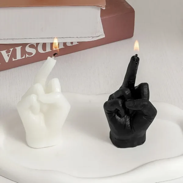 Candle shaped like a hand raising the middle finger