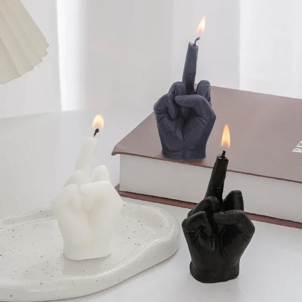 Candle shaped like a hand raising the middle finger