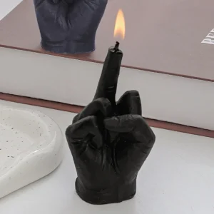 Candle shaped like a hand raising the middle finger