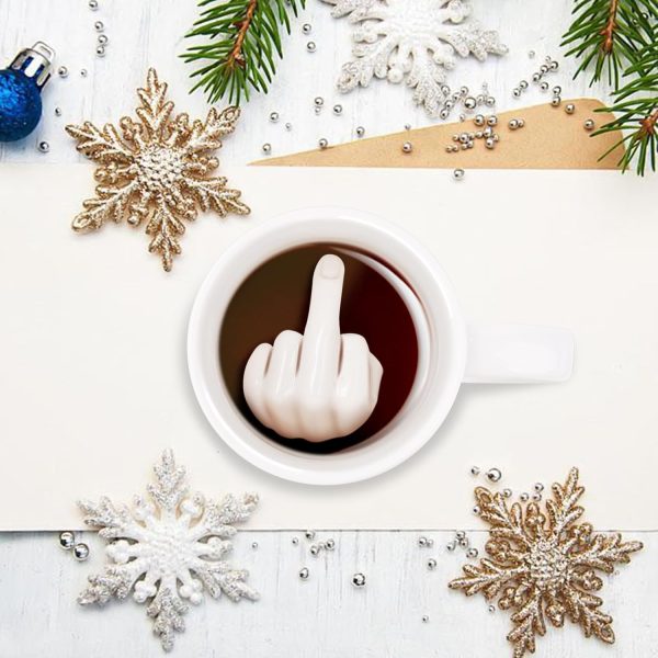 White mug with a sculpted middle finger inside