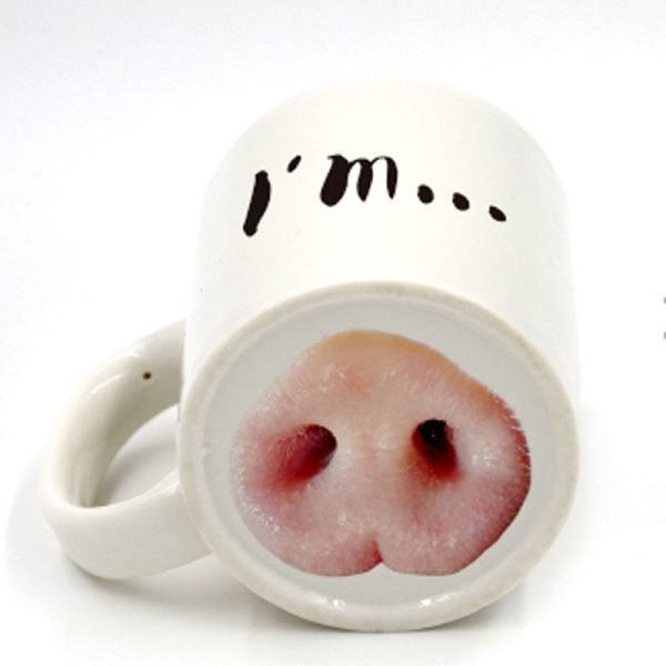 Ceramic mug with a pig nose printed inside the base