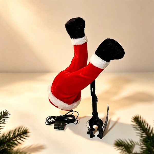 Santa legs sticking out of a Christmas tree