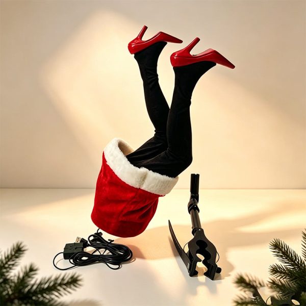 Santa legs sticking out of a Christmas tree