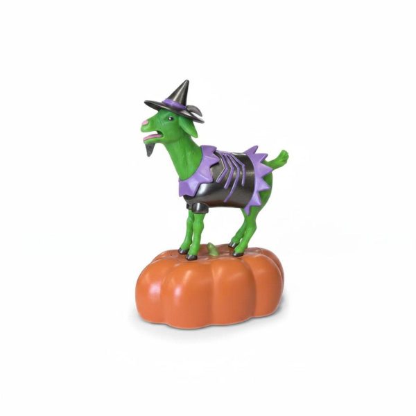 Goat figurine in a witch hat standing on a pumpkin