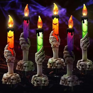 Skeleton hand candle holders with dripping candles
