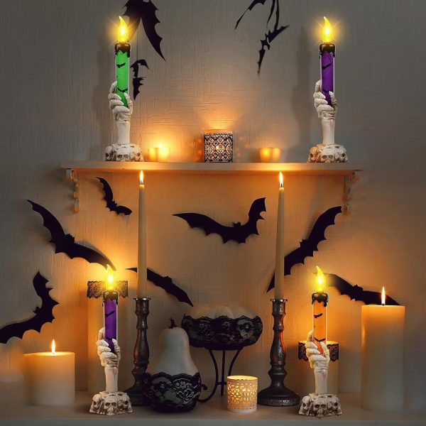 Skeleton hand candle holders with dripping candles