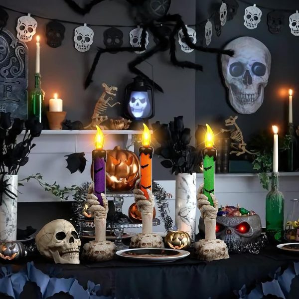 Skeleton hand candle holders with dripping candles