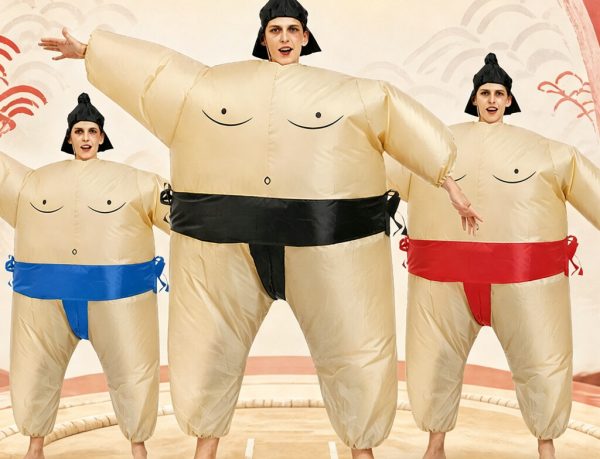 Inflatable sumo suit worn by three people