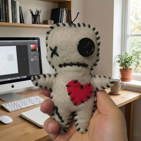 Handmade felt voodoo doll with button eyes