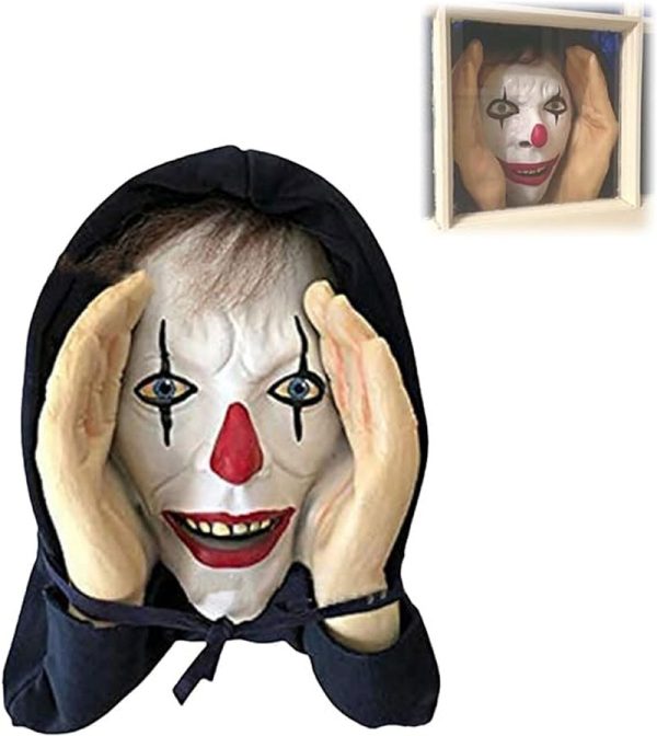 Scary peeper prop of a clown pressing his face to a window